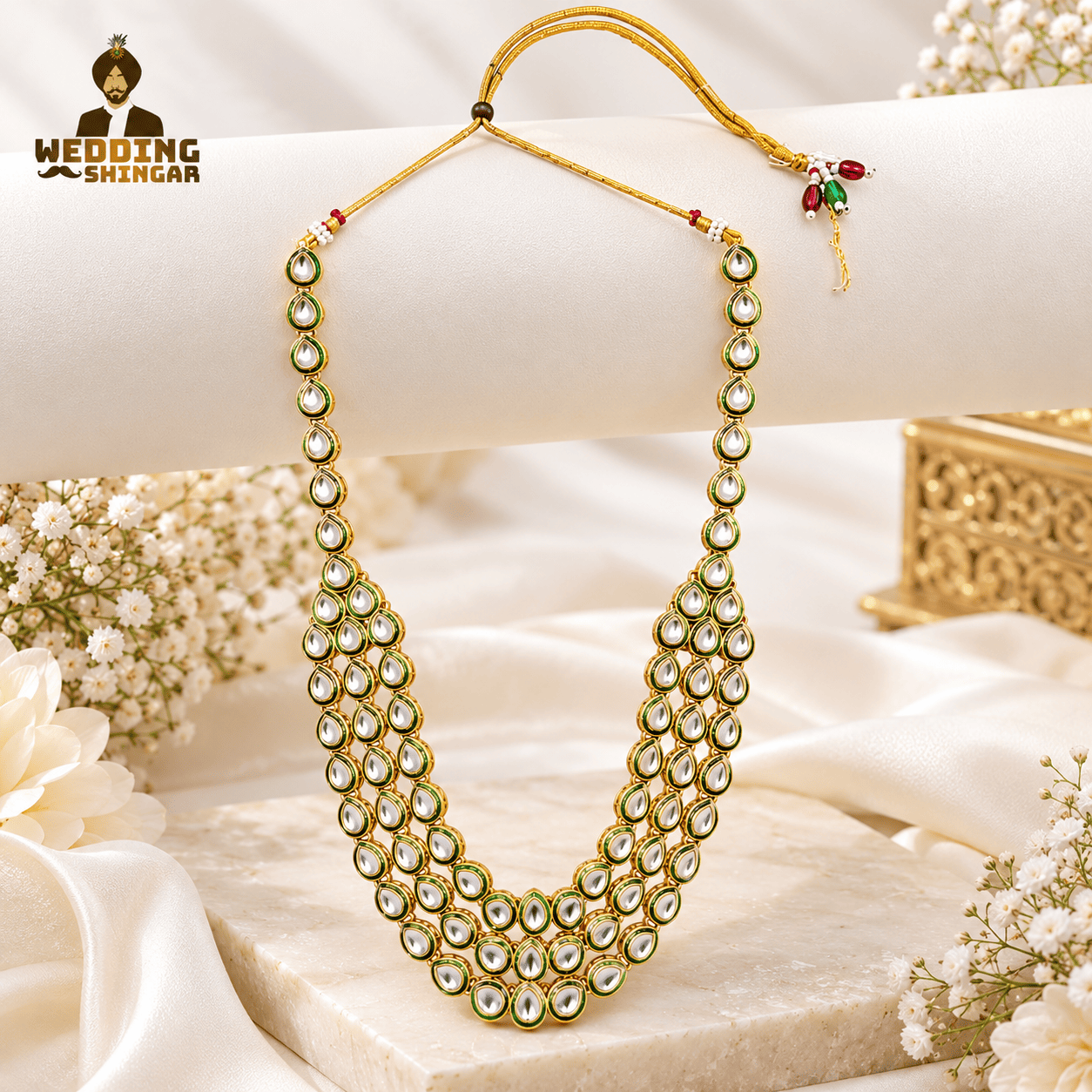 Royal green Kundan-style groom wedding mala with white teardrop stones and gold-tone detailing.